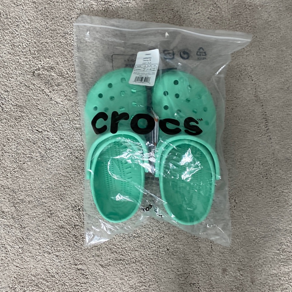 Mint green crocs